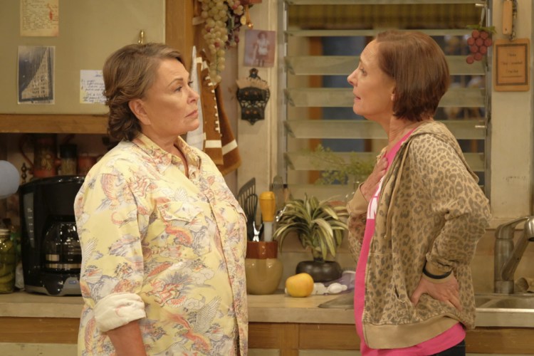 Roseanne Barr, left, and Laurie Metcalf appear in an episode of the rebooted "Roseanne," which ABC canceled after Barr's racist tweet.