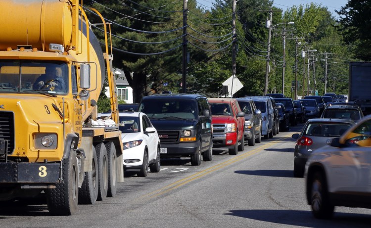 Traffic backs up Friday at the intersection of Industrial Park Road and Route 112 in Saco. Nearly 20,000 cars travel through the corridor each day on average, including more than 18,000 that use Industrial Park Road, according to the Maine Department of Transportation.