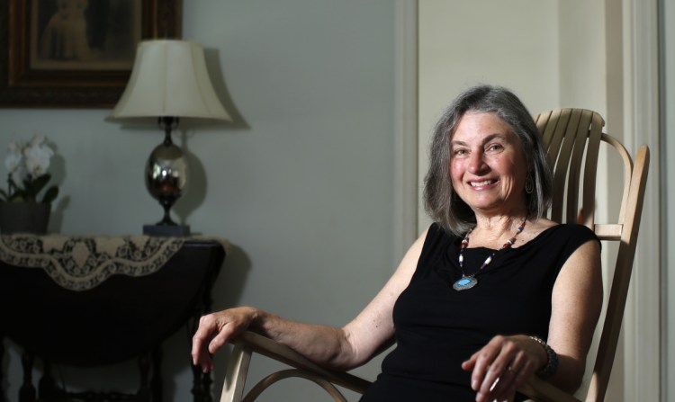 Linda Aldrich relaxes at her Portland home. The city's new poet laureate was inaugurated Tuesday to the honorary, volunteer position, replacing Gibson Fay-Leblanc. "I would like to bring poetry more into the lives of people who live here, no matter who they are," she said.