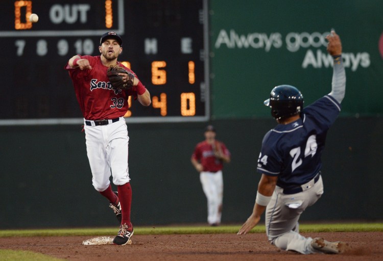 Portland's Nick Lovullo turns the double play as Binghamton's Jhoan Urena tries to break it up during the Sea Dogs' 3-2 loss on Friday at Hadlock Field.