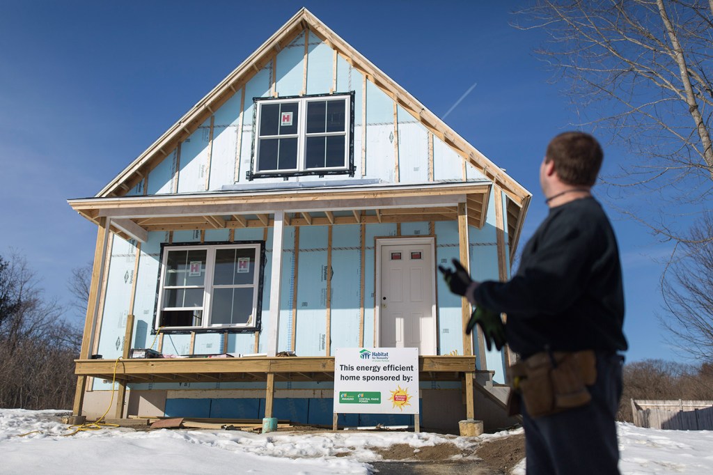 Jay Newcomb looks at his family's new house months before its completion. He said, "I just want to get in there and make it a home.”