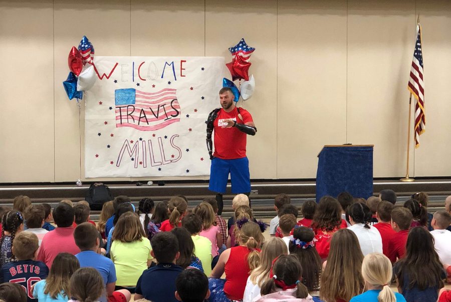 Travis Mills speaks May 23 to students and staff at Manchester Elementary School.
