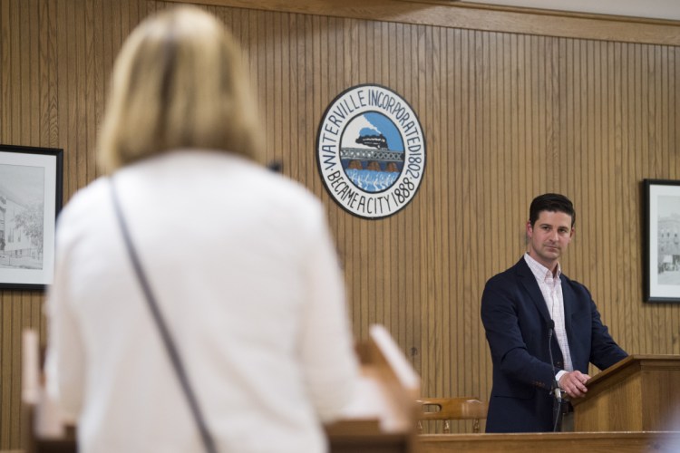 Hilary Koch, left, speaks out against remarks made on social media by Mayor Nick Isgro, right, during community notes at the City Council Chambers at The Center on May 15.
