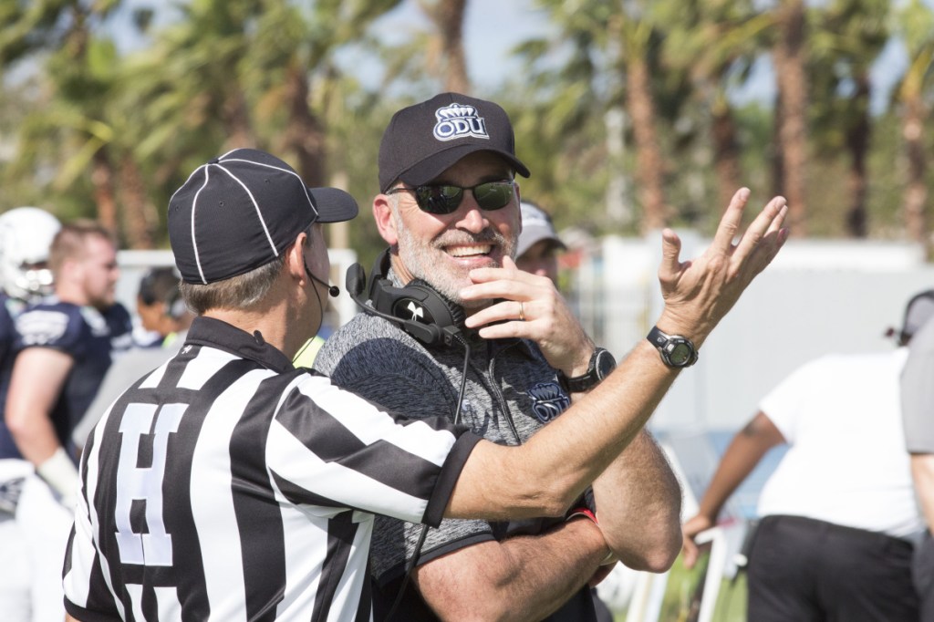 Old Dominion coach Bobby Wilder laughs with an official during the first half of the 2016 Bahamas Bowl against Eastern Michigan.