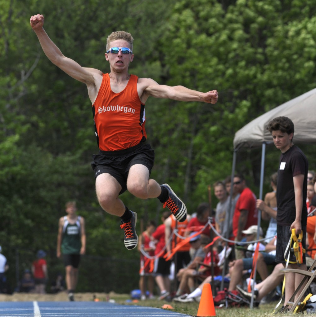 Skowhegan's Kyle Jacques jumps in the long jump competition at the Class A track and field state championships Saturday in Bath.