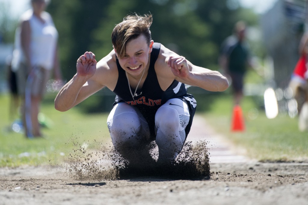 Winslow's Jake Warn competes in the triple jump at the Class B track and field state championships Saturday at Foxcroft Academy.