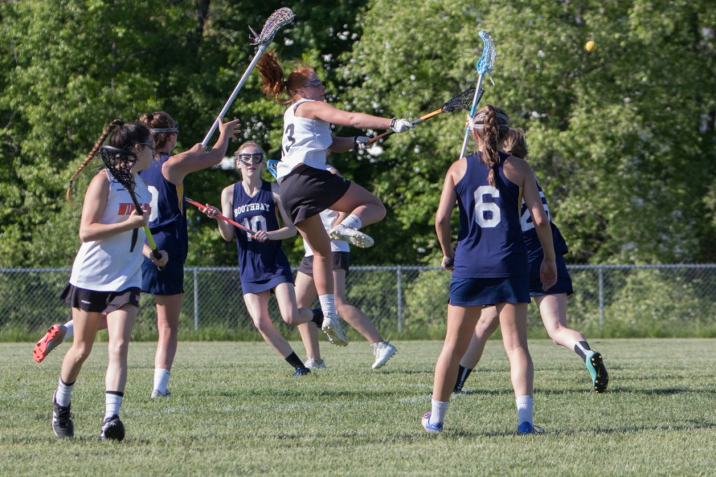 Winslow senior captain Sarah Stevens takes a shot on goal during the regular season finale May 29 against Boothbay at Kennebec Savings Bank Field in Winslow.