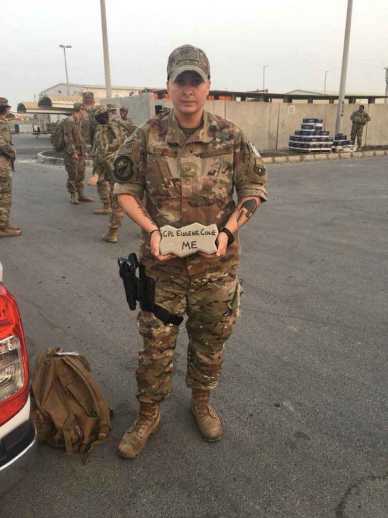 Katelyn Nichols, a staff sergeant with the Maine National Guard, carried a brick in memory of Corp. Eugene Cole from the Somerset Sheriff's Office during a 5K carrying a brick with the name of a fallen officer.