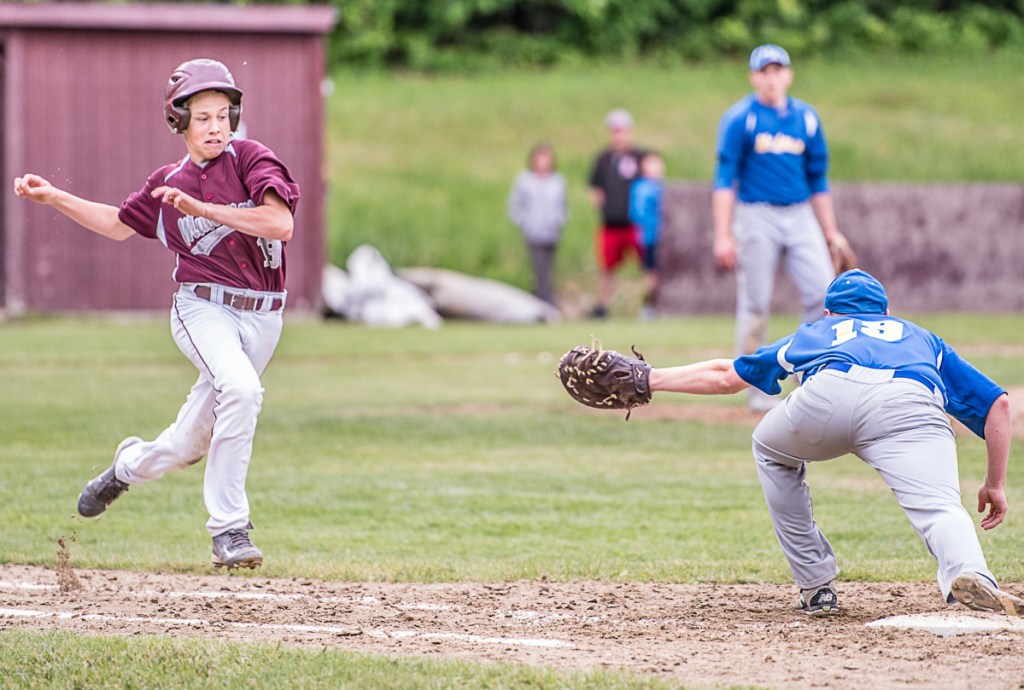 Monmouth's Cam Armstrong runs to first base and beats the throw to Mt. Abram's Bryce Werzanski in a Class C South prelim game Tuesday afternoon in Monmouth.