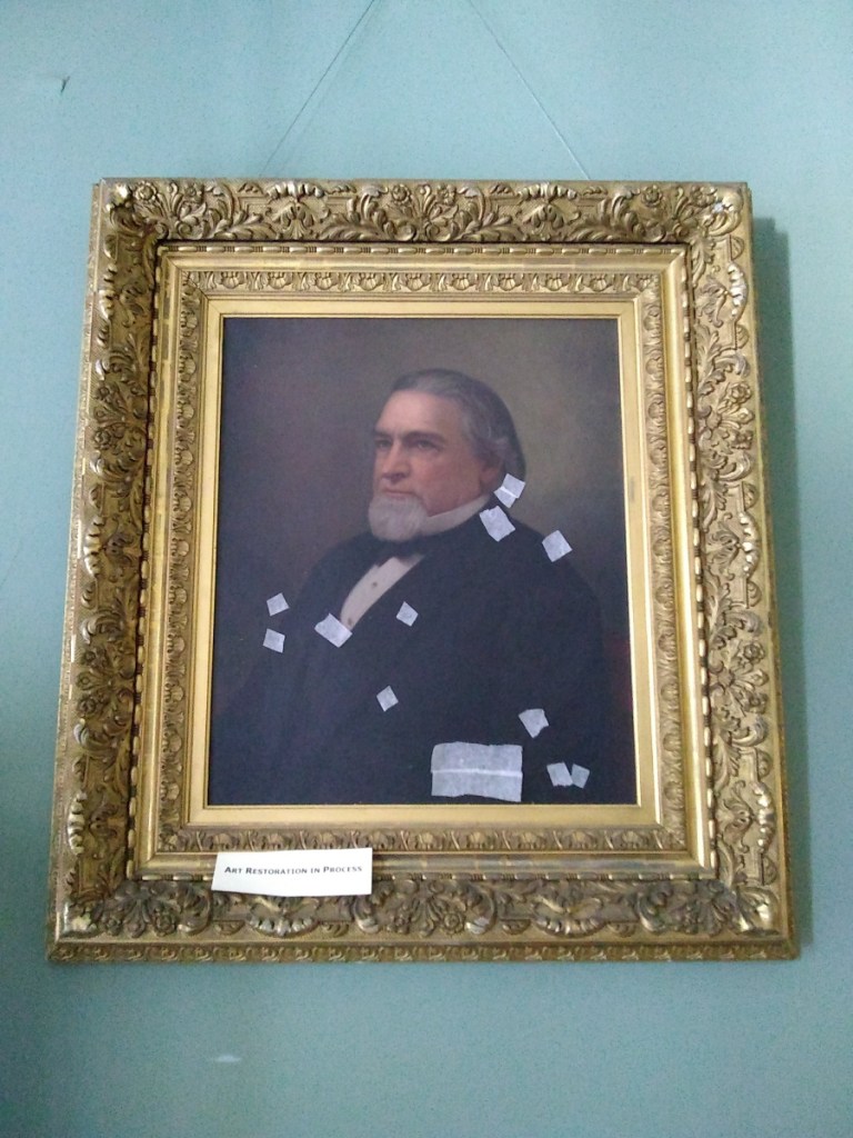 An 1885 oil portrait of Cadwallader Colden Washburn by professional portrait artist William F. Cogswell will be the first painting restored with funds from GeneralMills. Bandages keep flaking paint in place and prevent further damage.