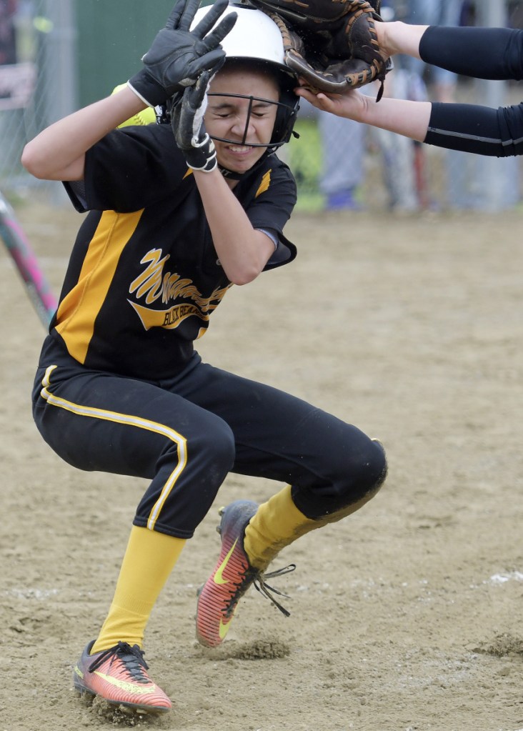 Staff photo by Andy Molloy 
 Hall-Dale's Sarah Benner doesn't get the tag on time on Maranacook's Abby Jacques at home plate during a Class C South game Wednesday in Farmingdale.