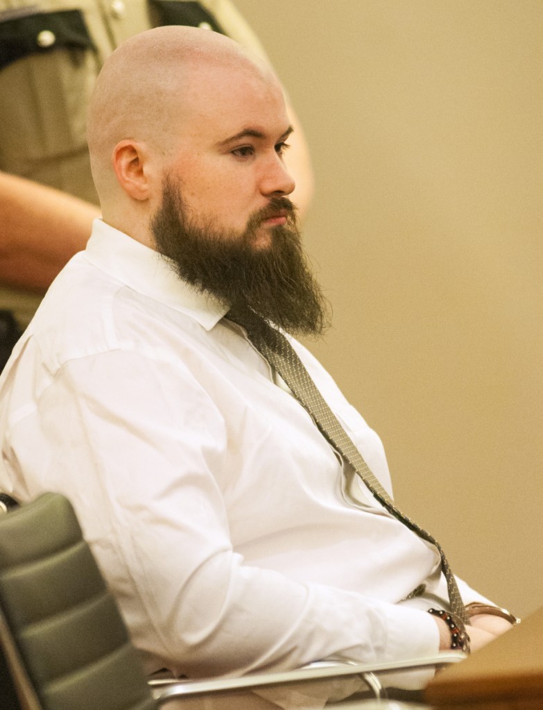 Leroy Smith III sits in a courtroom during a Jan. 20, 2017, hearing on his mental competence to be tried for murder in connection with the slaying and dismembering of his father.