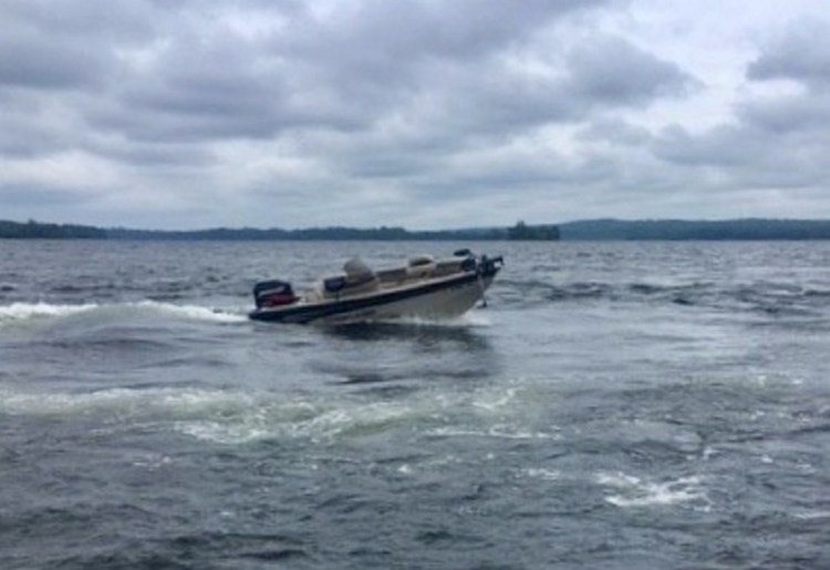 George F. Bonney's unmanned motorboat is seen moving in circles Thursday on Great Pond in Belgrade. Bonney's submerged body was discovered nearby.