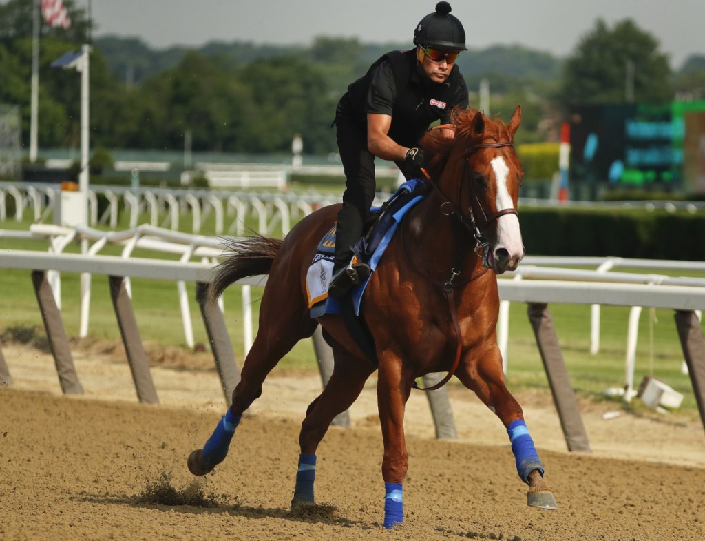 Triple Crown hopeful Justify gallops around the main track during a workout Friday at Belmont Park in Elmont, New York. Justify will attempt to become the 13th Triple Crown winner when he races in the 150th running of the Belmont Stakes on Saturday.