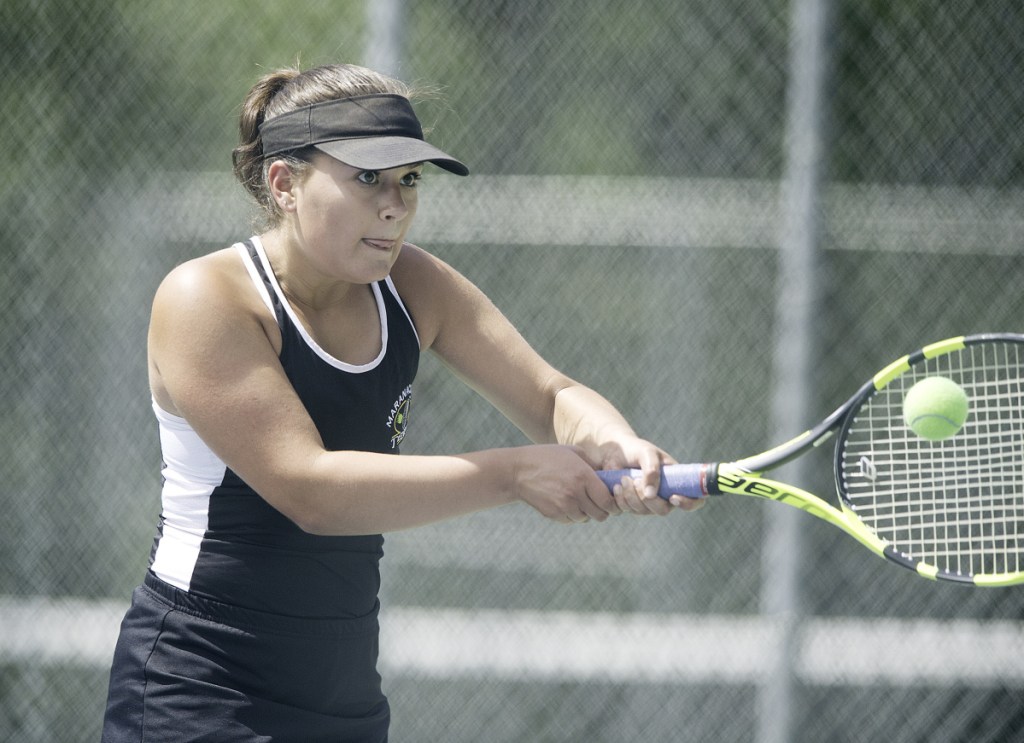 Maranacook No. 2 singles player Emma Wadsworth returns a shot during  the Class C state championship match against Mattanawcook on Saturday in Lewiston.