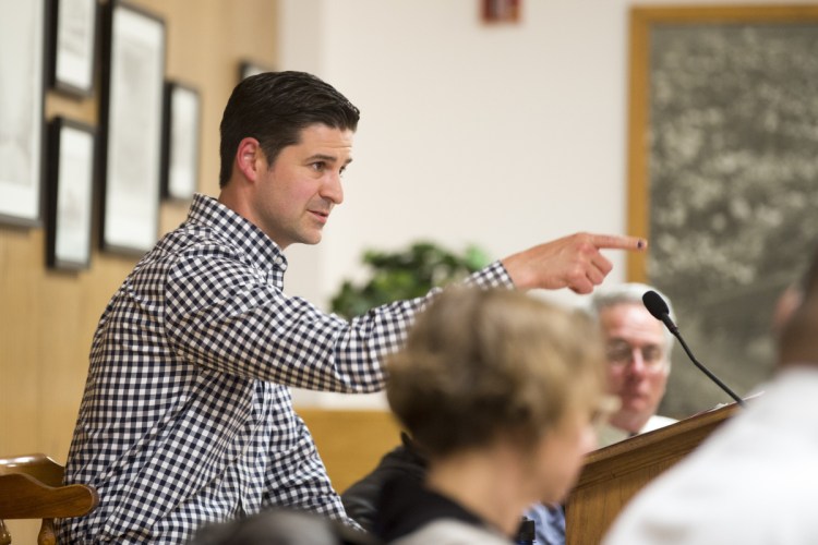 Mayor Nick Isgro points to City Manager Mike Roy, interrupting him after having asked Roy to clarify a proposed outdoor dining ordinance during a budget meeting Tuesday at a City Council chamber at The Center in Waterville.