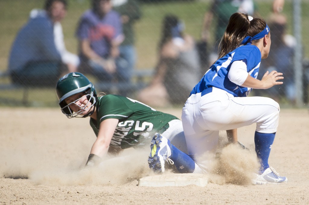 Winthrop's Sam Allen (15) slides safely into second base before Madison's Annie Worthen can apply the tag in a Class C South semifinal Saturday in Madison.