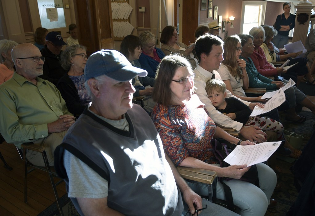 An overflow crowd sat Monday outside the Hallowell City Council chambers to discuss funding for the Hubbard Free Library.
