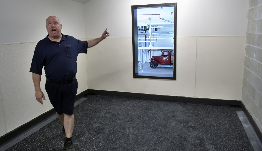 Winthrop Fire Chief Dan Brooks walks Thursday through the water proof training room on the second floor of the new Winthrop Fire Station.
