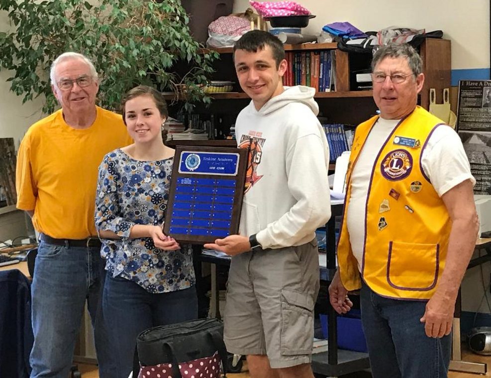 Whitefield Lions and Leo Advisors Cal Prescott and Barry Tibbetts recently presented outgoing officers vice president Sam Stevens and president Harrison Mosher a plaque commemorating the first Leo Club formed in May 2017. From left are Prescott, Stevens, Mosher and Tibbetts.
