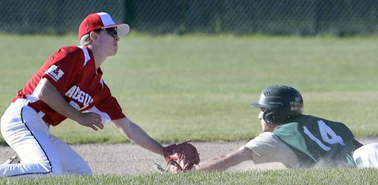 Augusta's Jacob Brown tags Bessey Motors' Brayden Bean at second during an American Legion game Tuesday in Augusta.