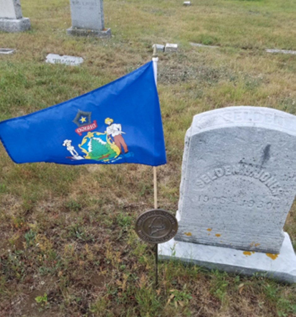 A brass plaque and flag holder, which had been placed on Officer Rufus Lishness's grave, has been stolen. This is a photo provided by Augusta police of a similar one placed at a gravesite of another Augusta police officer killed in the line of duty.