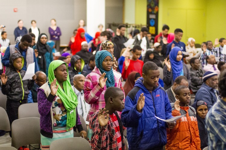 About 80 immigrants ages 7 to 22 became U.S. citizens March 10, 2016, in a naturalization ceremony at the Portland Public Library. Despite the end of the Trump administration's policy of separating families, concern remains among those who work with immigrants in Maine because the executive order also allows for the construction of detention facilities, if necessary, to hold families as they go through immigration proceedings, and seeks to override a law limiting the number of days children can stay in detention facilities.