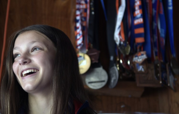 Kaci-Lee Ver Sluis, 12, laughs from her Sabattus home Wednesday. Ver Sluis is competing in the Judo Junior Olympics in Spokane, Washington, and then traveling to Japan for training.
