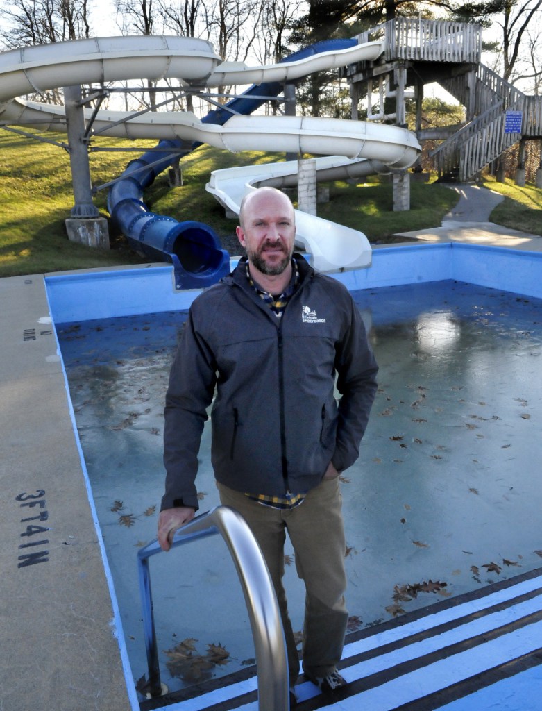 Matt Skehan, director of Waterville Parks and Recreation, stands beside the popular water slide Dec. 6, 2017, at the Alfond Municipal Pool in Waterville. The City Council has awarded a contract to Vortex Aquatic Structures International to replace the pool and its slides after this summer.