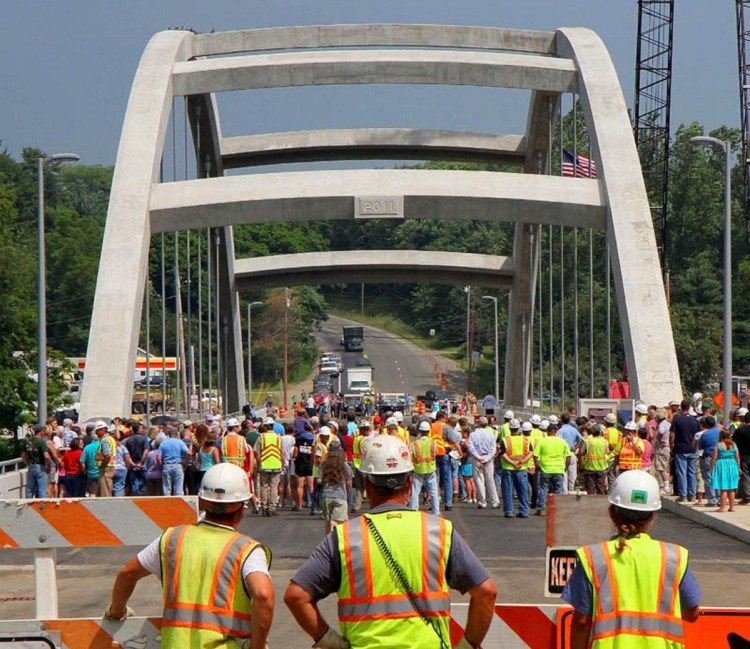 Maine Department of Transportation workers, spectators and dignitaries gather in July 2011 for a ceremony opening a $22 million bridge in Norridgewock. The Legislature has passed a bill calling for naming it the Cpl. Eugene Cole Memorial Bridge, in honor of a Somerset County sheriff's deputy who was killed April 25 while on duty.