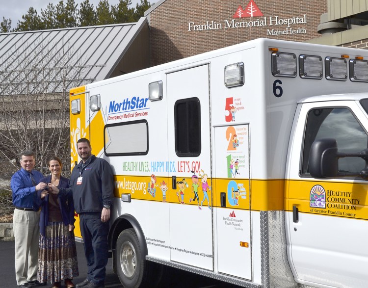 NorthStar EMS in Farmington unveiled its third health-theme painted ambulance on March 11, 2016, to the community. From left, are Gerald Cayer, executive vice president; Dr. Lorien Batt, lead physician, Franklin Health Pediatrics; and Mike Senecal, director of NorthStar ambulance. Franklin County commissioners will consider on Tuesday charging the ambulance service a fee for using county dispatch services.