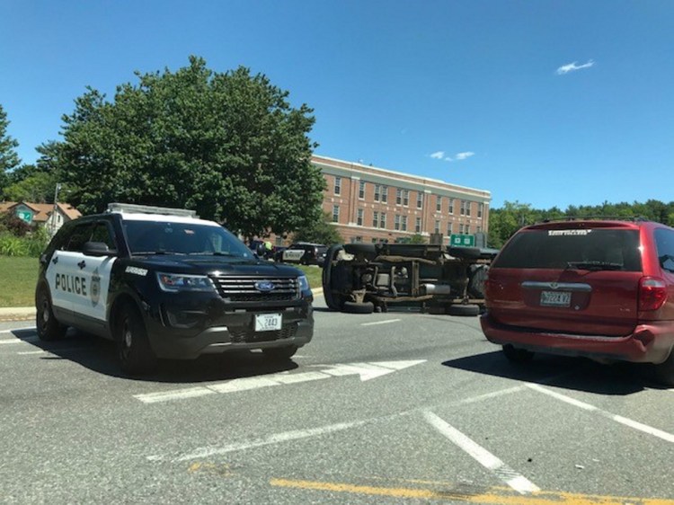 An SUV rolled onto its side Tuesday on Cony Circle in Augusta, obstructing traffic for nearly a half-hour.