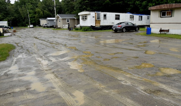 Neighbors said Eddie Mayfield was shot early Thursday morning and left in the mud of the New Road in Newport at the Gilman Trailer Park. Nathan Wheeler, who is charged in the shooting, was found at his grandmother's mobile home, where he lives.