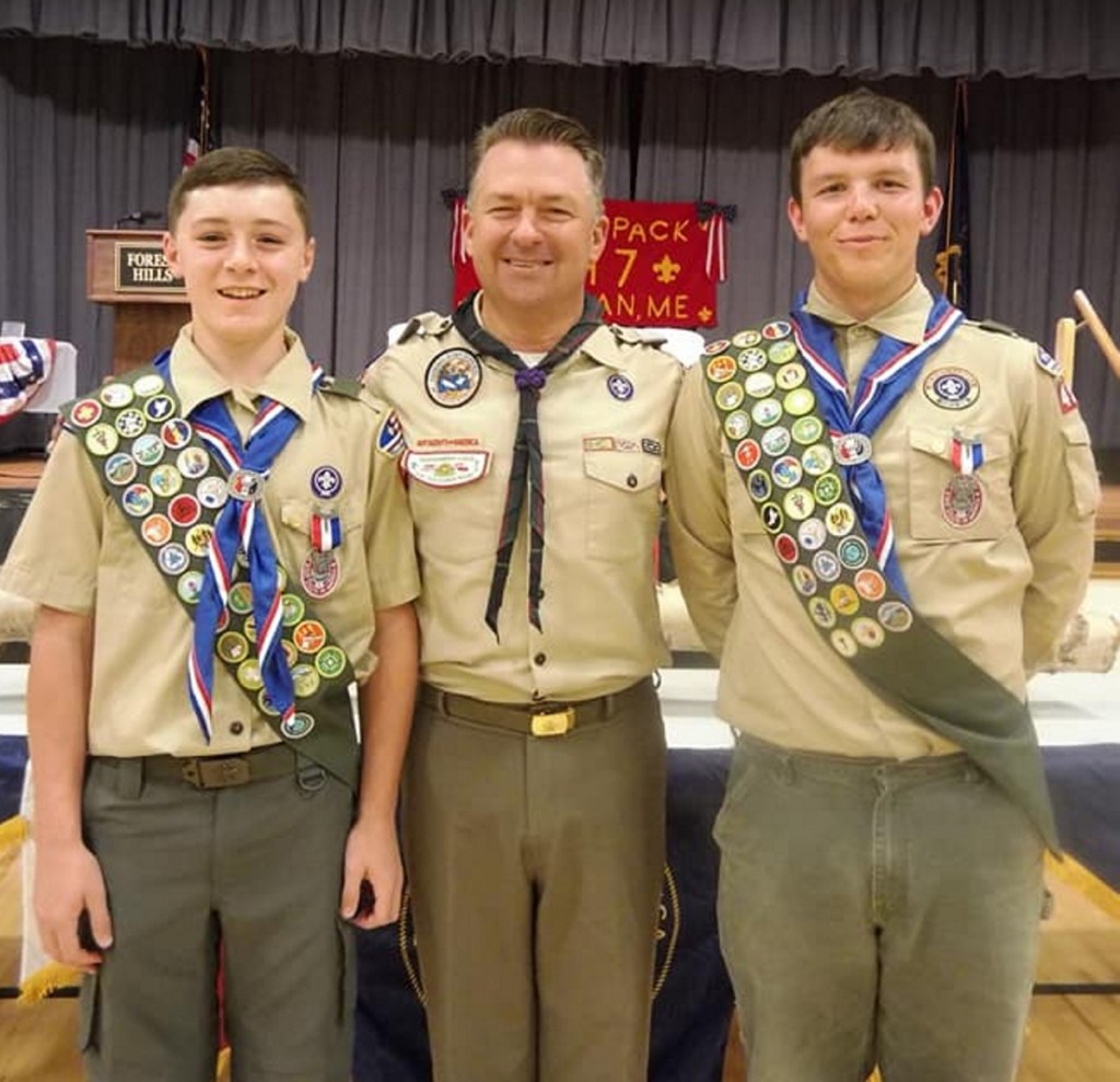 Pine Tree Council Scout Executive Eric Tarbox, center, with Eagle Scouts Parker Desjardins, left, and Hunter Cuddy, right.