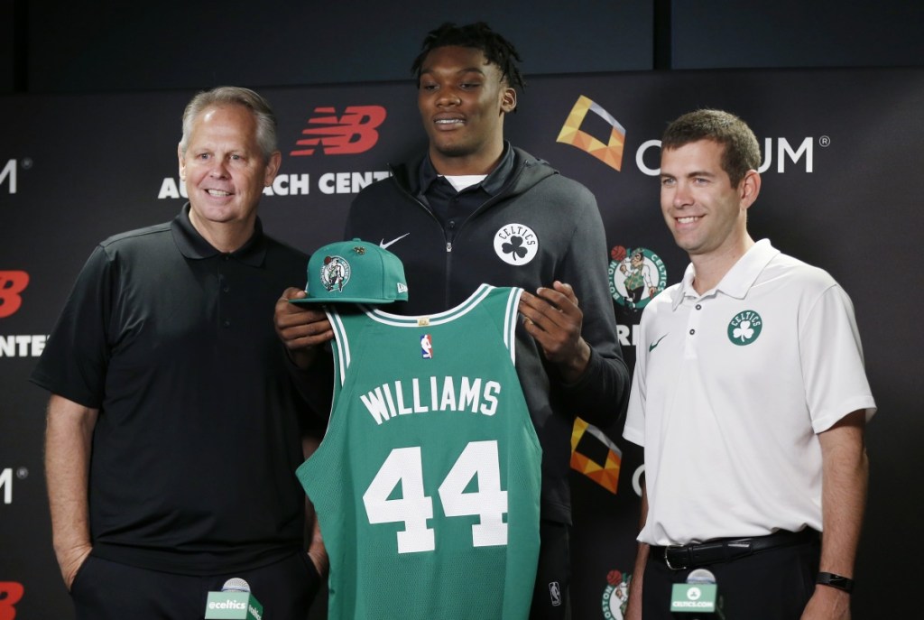 Boston Celtics draft pick Robert Williams, center, poses with general manager and President of Basketball Operations Danny Ainge, left, and head coach Brad Stevens during a news conference Friday in Boston.