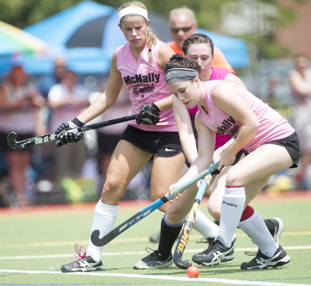 North All-Star's Addi Williams, center, battles for the ball with South All-Star's Sydney Meredith-Pickett (6) and Maddison LeBeau (21) at the McNally Senior All-Star field hockey game Saturday at Thomas College in Waterville.