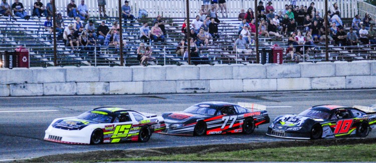 Staff photo by Joe Phelan
Nick Hinkley (15) leads Nick Reno (77) and Kevin Douglass (18) during a Pro Stock feature Saturday night at Wiscasset Speedway. Hinkley won his third race of the season.