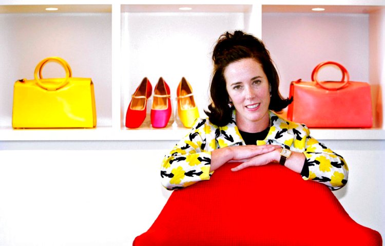 Designer Kate Spade poses with handbags and shoes from her next collection in New York in May, 2004. 