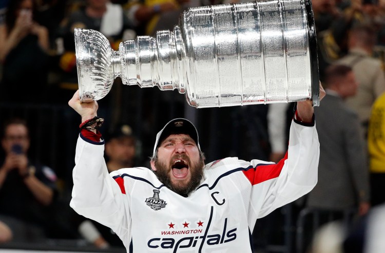 Washington Capitals left wing Alex Ovechkin hoists the Stanley Cup after the Capitals defeated the Golden Knights in Game 5 of the Stanley Cup Finals on Thursday night in Las Vegas.