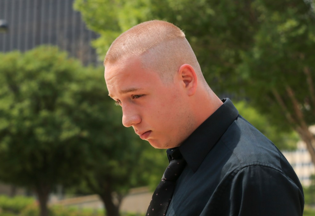 Shane Gaskill, 19, of Wichita, Kan., leaves the federal court in Wichita, Wednesday, June 13, 2018. Gaskill and Casey Viner, 18, of North College Hill, Ohio, online gamers whose alleged dispute over a $1.50 Call of Duty WWII video game bet ultimately led police to fatally shoot a Kansas man, pleaded not guilty Wednesday to charges related to the "swatting" case that drew national attention. 
