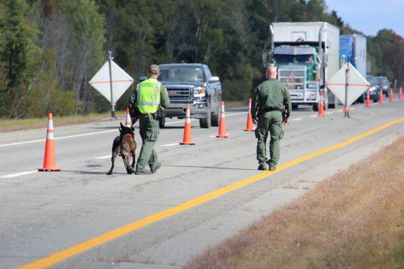 U.S. Border Patrol agents operate an immigration checkpoint in June on I-95 in Penobscot County.
