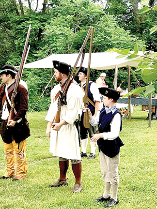 Historical reenactors portray a typical day in an 18th century encampment.  Contributed photo
