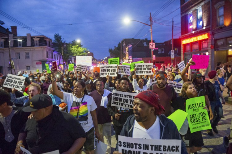 Demonstrators protesting the fatal police shooting of Antwon Rose Jr. march through the South Side section of Pittsburgh on June 23. The police shooting of Rose as he fled during a traffic stop on June 19 is the first in the Pittsburgh area in the Black Lives Matter era.