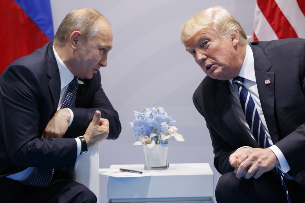 FILE - In this Friday, July 7, 2017, file photo U.S. President Donald Trump meets with Russian President Vladimir Putin at the G-20 Summit in Hamburg. 
