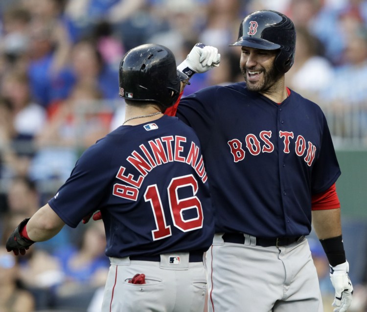Boston Red Sox designated hitter J.D. Martinez, right, was named to the American League starting lineup for the All-Star game. Andrew Benintendi, meanwhile, is one of five players on the final vote ballot.