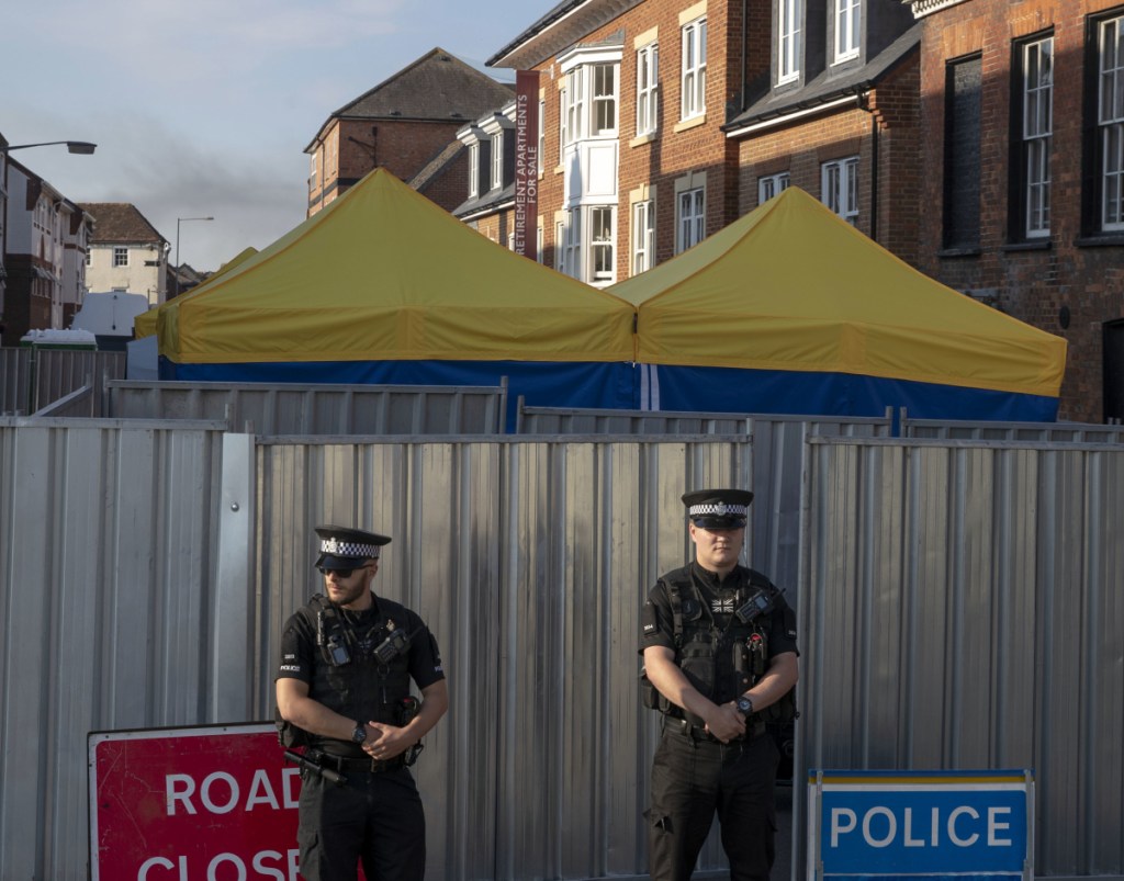 Police secure a point of interest in Salisbury, where counter-terrorism officers were investigating Monday after a woman and her partner were exposed to a nerve agent.