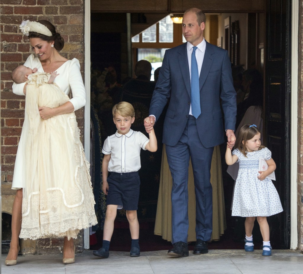 Britain's Prince William and Kate, Duchess of Cambridge, with their children Prince George, Princess Charlotte and Prince Louis arrive for Prince Louis' christening service at the Chapel Royal, St James's Palace, in London on Monday.