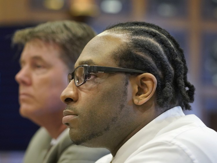 David W. Marble Jr. and his attorney Jon Gale listen as Assistant Attorney General Meg Elam makes her opening statement at the Cumberland County Courthouse in Portland on Tuesday, July 10, 2018. Marble is on trial for two murder charges stemming from the Dec. 25, 2015 shooting deaths of Eric Williams and Bonnie Royer in Manchester. 
