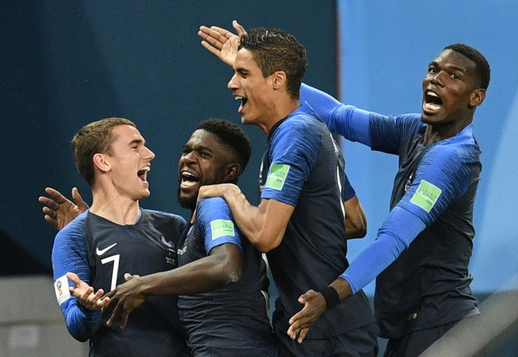 Samuel Umtiti, second from left, is congratulated by teammates Antoine Griezmann, Raphael Varane and Paul Pogba, from left, after scoring a goal Tuesday in France's 1-0 semifinal victory over  Belgium at the World Cup in the St. Petersburg Stadium in Russia. (AP Photo/Martin Meissner)