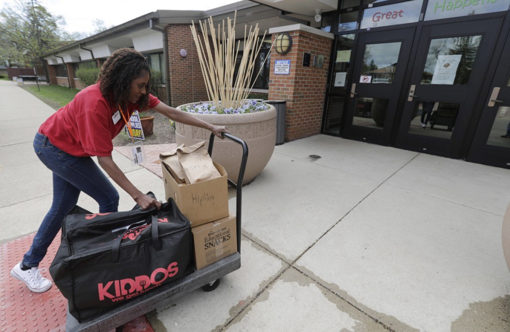 Nichele Gilling of Kiddos Catering in Chicago delivers prepared lunches to Kipling Elementary School in Deerfield, Ill. Many parents still make their kids' lunch or sign up for a hot-lunch program, but others order from companies that deliver meals to homes or schools.